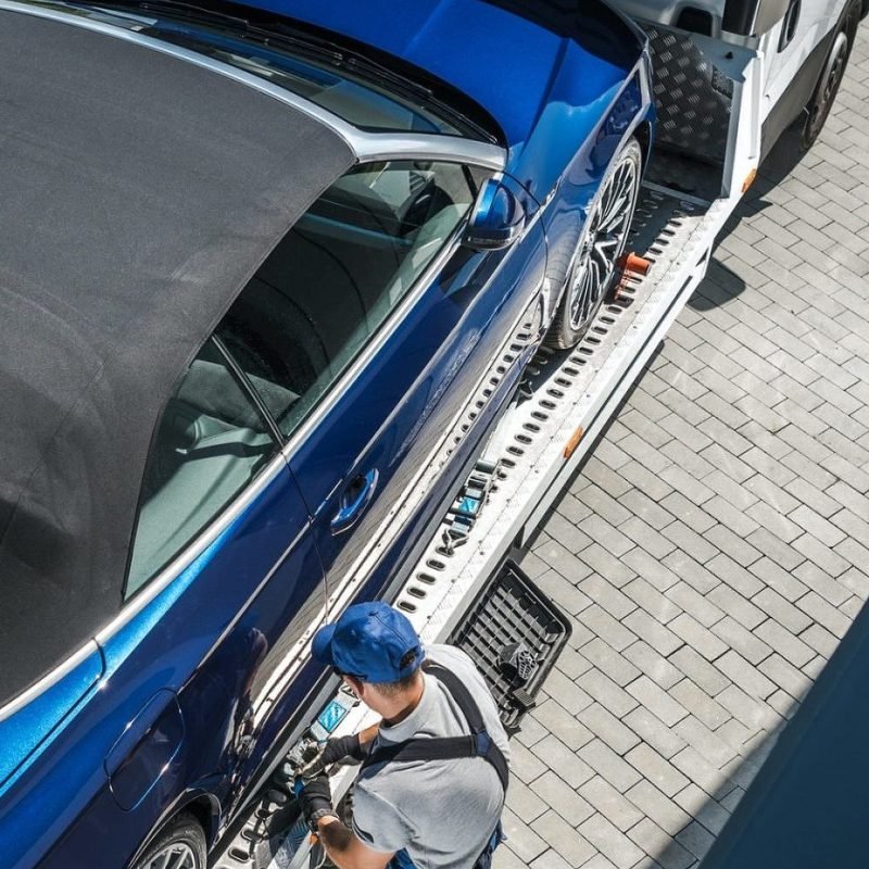 new-car-home-delivery-on-a-towing-truck-e1632210556894.jpg